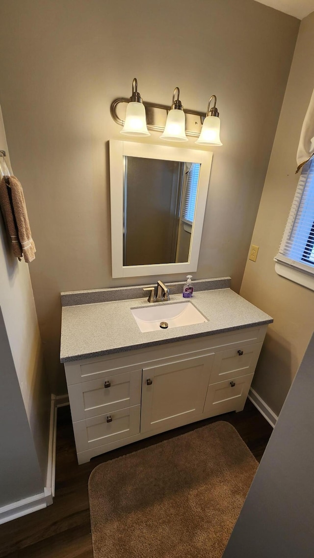 43 Dale Dr, Kimberling City, MO 65686 - bathroom with baseboards, wood finished floors, and vanity