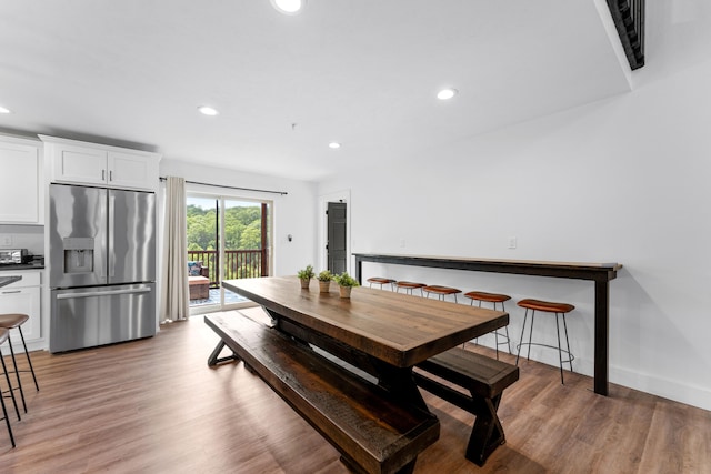 dining area with hardwood / wood-style floors