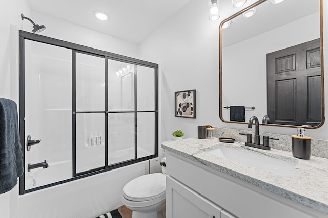 full bathroom featuring bath / shower combo with glass door, toilet, and vanity