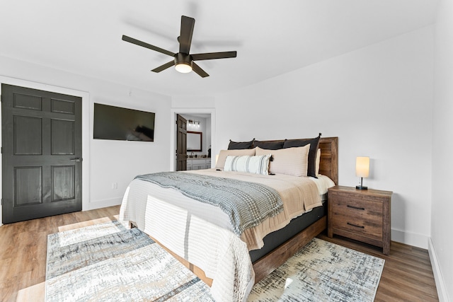 bedroom with wood-type flooring and ceiling fan