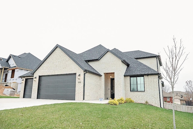 view of front facade with a garage and a front yard