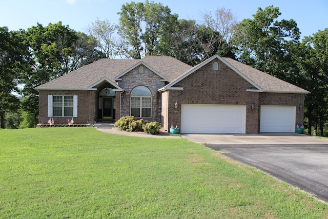 ranch-style home with a front yard and a garage