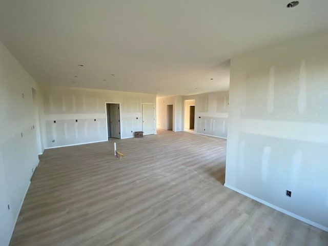 empty room with light wood-type flooring