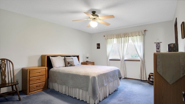 bedroom with ceiling fan and carpet