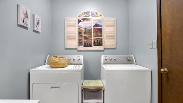 washroom with laundry area and washer and dryer