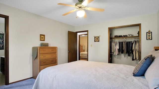 carpeted bedroom featuring a closet, a ceiling fan, and baseboards