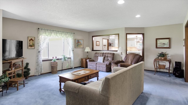 living room featuring light carpet, a textured ceiling, and recessed lighting