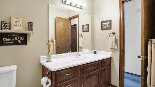 bathroom with vanity and toilet