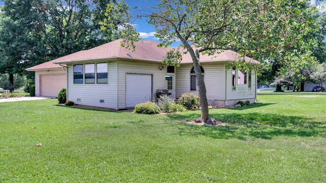 single story home featuring a garage and a front lawn