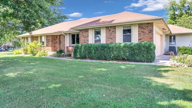 single story home with a garage, central air condition unit, a front lawn, and brick siding