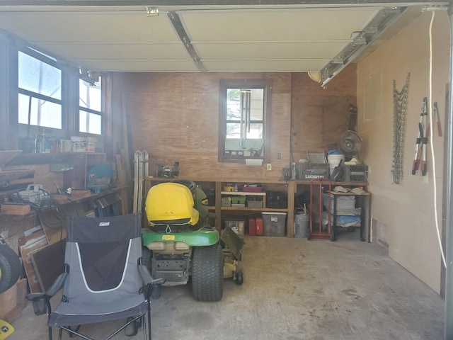 miscellaneous room with a workshop area and unfinished concrete floors