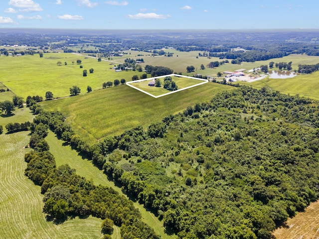 birds eye view of property with a rural view