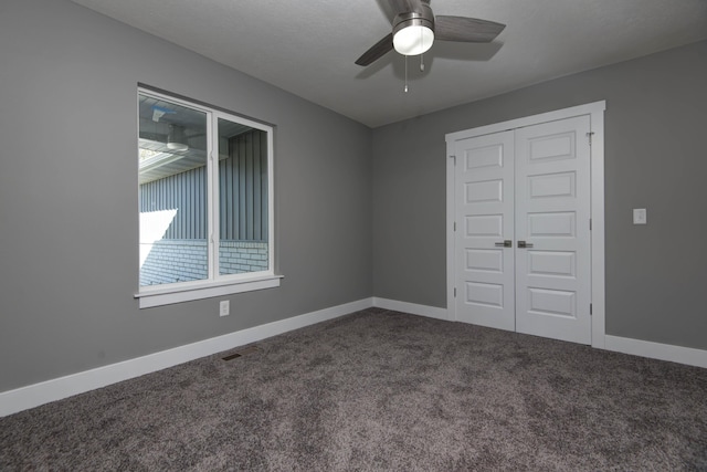 3668 W Overland St, Springfield, MO 65807 - unfurnished bedroom with carpet flooring, a closet, baseboards, and ceiling fan