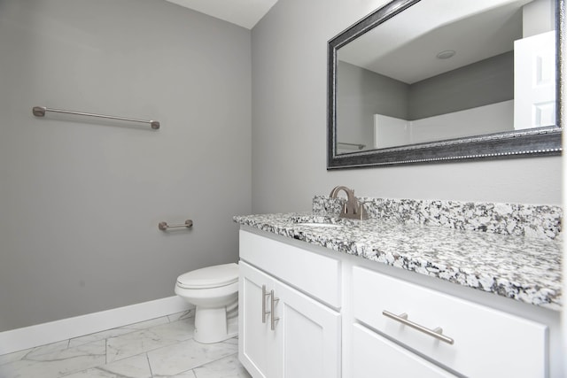 bathroom with toilet and vanity