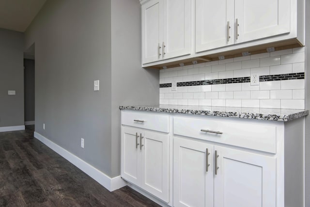 3668 W Overland St, Springfield, MO 65807 - kitchen with dark wood finished floors, decorative backsplash, light stone counters, and white cabinetry