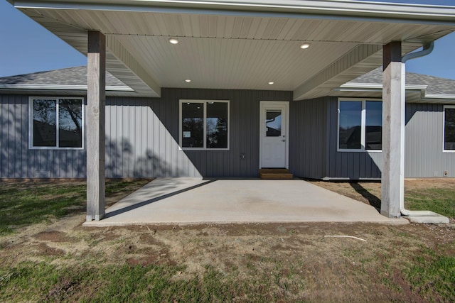 3668 W Overland St, Springfield, MO 65807 - doorway to property featuring a patio and a shingled roof
