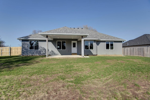 3668 W Overland St, Springfield, MO 65807 - back of property featuring a patio area and a shingled roof