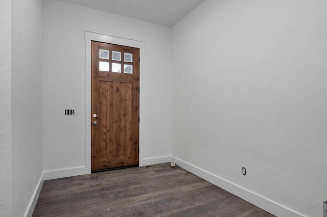 foyer entrance with dark hardwood / wood-style flooring