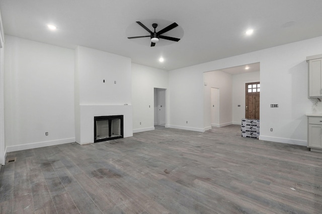 unfurnished living room with ceiling fan and light hardwood / wood-style flooring