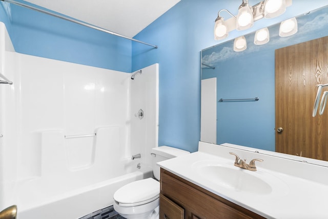 full bathroom with toilet, vanity, and shower / washtub combination