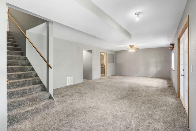 interior space featuring ceiling fan and carpet flooring