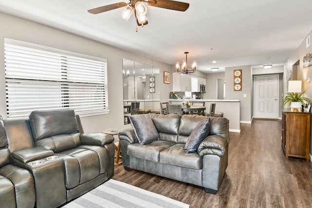 living room with ceiling fan and dark hardwood / wood-style floors