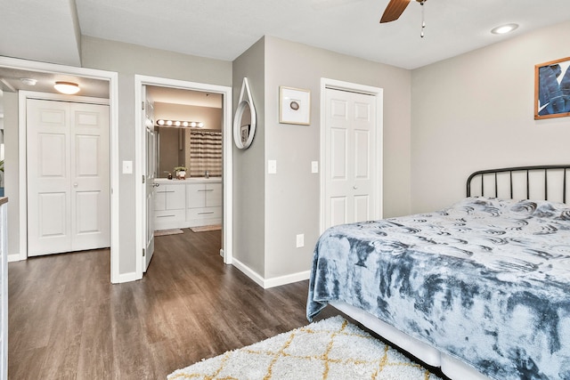 bedroom with ceiling fan, sink, connected bathroom, and dark hardwood / wood-style flooring