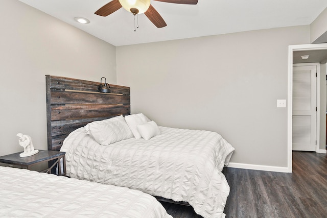 bedroom featuring dark hardwood / wood-style flooring and ceiling fan