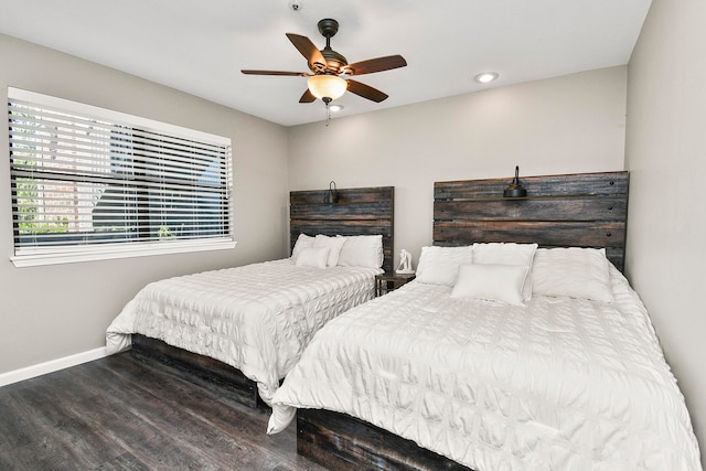 bedroom with ceiling fan and hardwood / wood-style floors