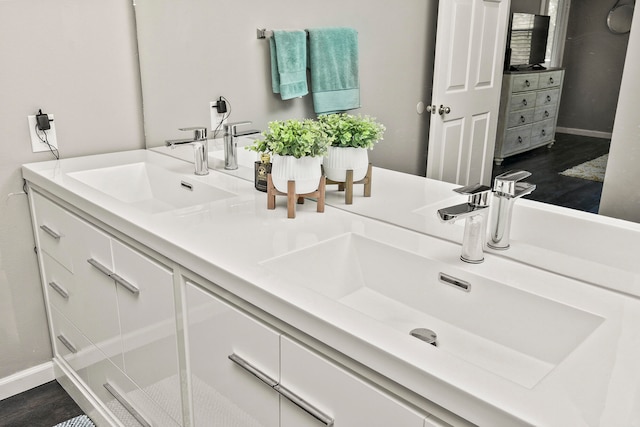 bathroom with an enclosed shower, hardwood / wood-style flooring, and vanity