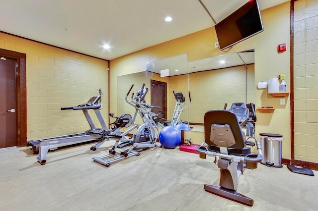 exercise room with concrete flooring