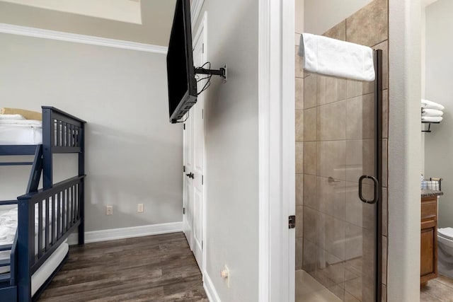 interior space featuring dark hardwood / wood-style floors and crown molding