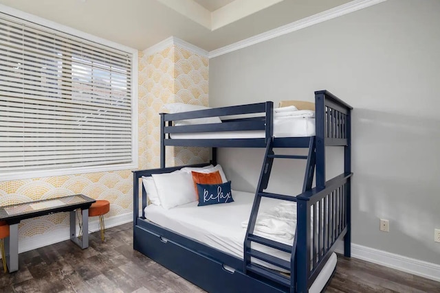 bedroom with crown molding and dark hardwood / wood-style flooring