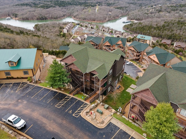 birds eye view of property with a water view