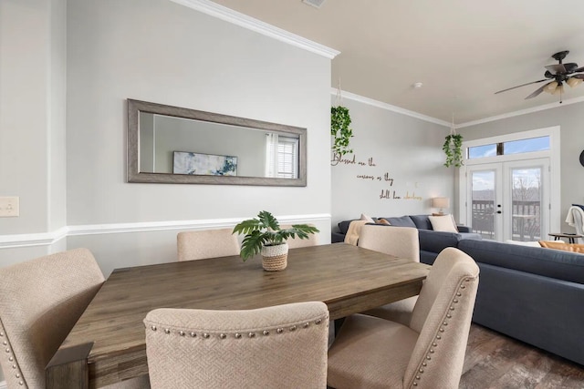 dining area with french doors, crown molding, dark hardwood / wood-style flooring, and ceiling fan