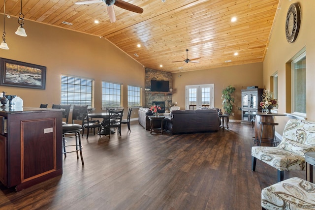 living room featuring wood-type flooring, ceiling fan, high vaulted ceiling, and a healthy amount of sunlight