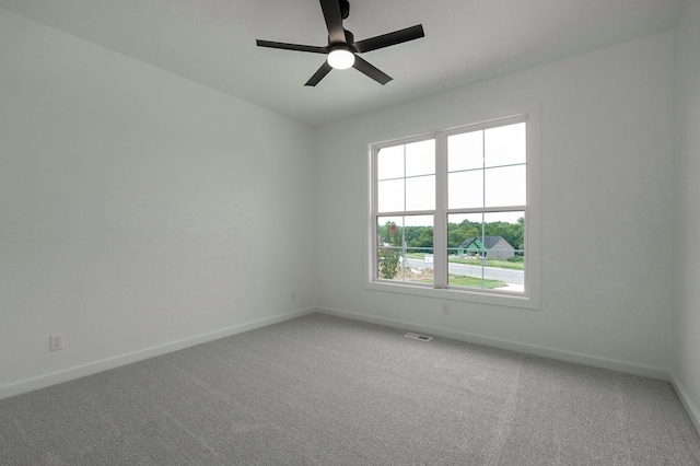 empty room with carpet floors and ceiling fan