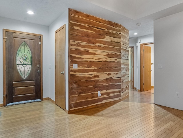 foyer entrance with light hardwood / wood-style floors