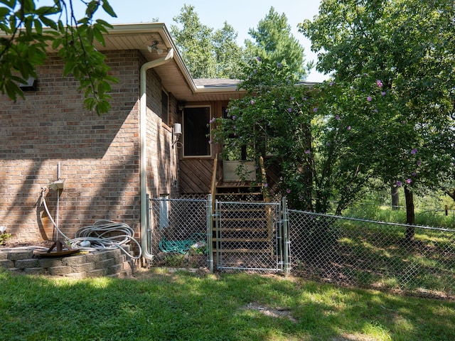 view of side of home featuring a yard