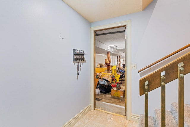 corridor with a textured ceiling