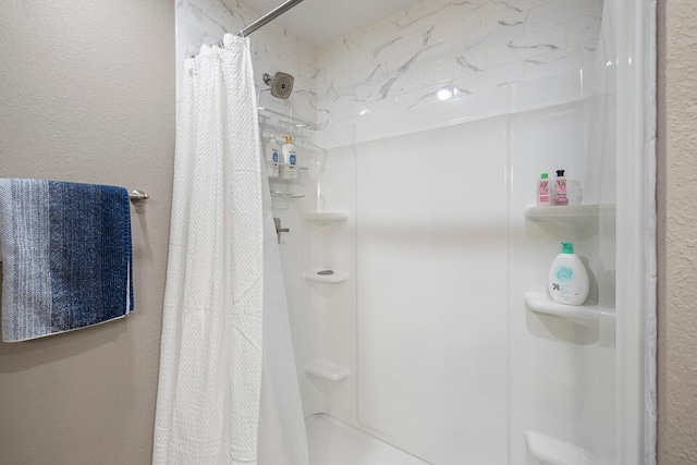 132 Highland Dr Unit 8, Branson, MO 65616 - bathroom with a textured wall and a stall shower