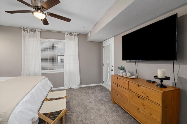 bedroom featuring ceiling fan and light carpet