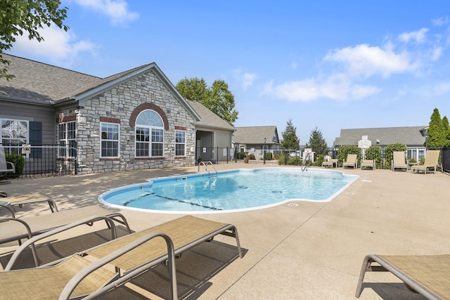 view of swimming pool with a patio