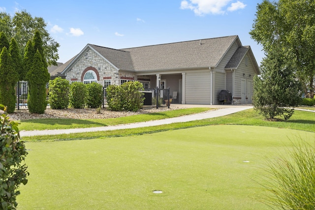 view of home's community with a lawn