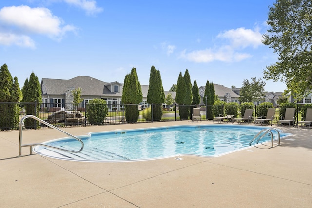 view of swimming pool featuring a patio area