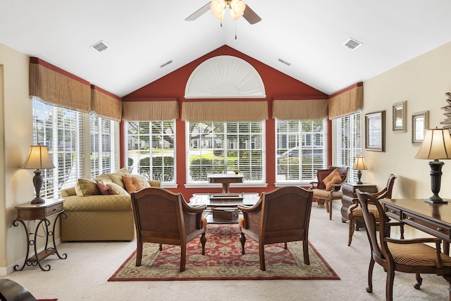 sunroom with lofted ceiling and ceiling fan