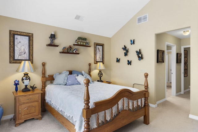 bedroom featuring light colored carpet and lofted ceiling