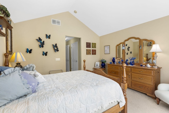 bedroom with lofted ceiling and light colored carpet