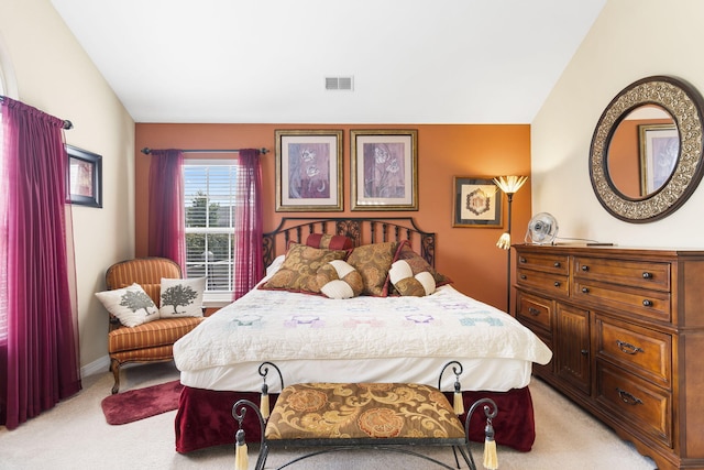 carpeted bedroom featuring lofted ceiling