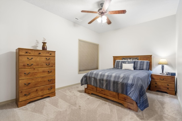 bedroom featuring light carpet, baseboards, visible vents, and a ceiling fan